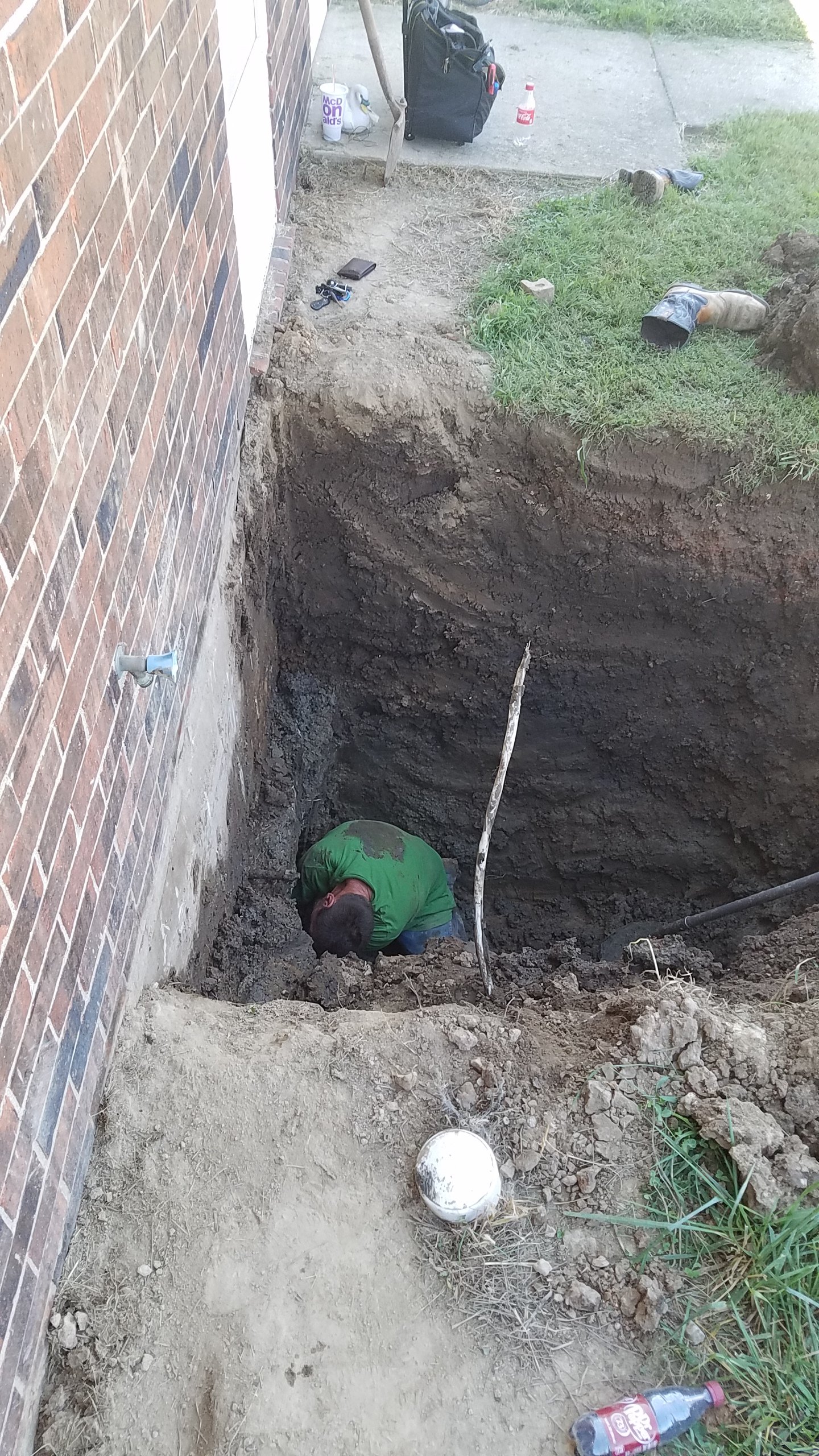 Digging 10 ft under the foundation to fix a water leak