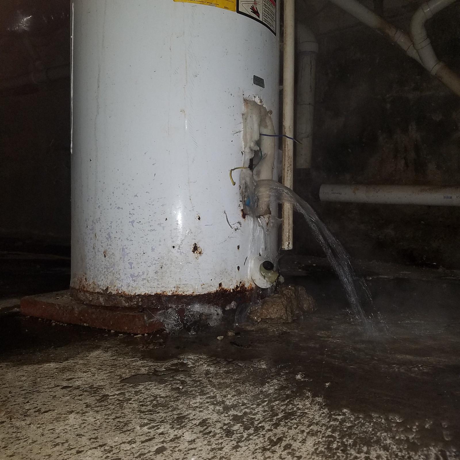 This looks like a bad leak but it\'s not. We re-build water heaters. We replace both thermostats and elements AND vacuum out the lime. This water heater was in a basement and the floor drain was right next to it. So we pulled the bottom element and the water went right down the drain. We had the water heater re-build and the water turned back on within 30 minutes. 