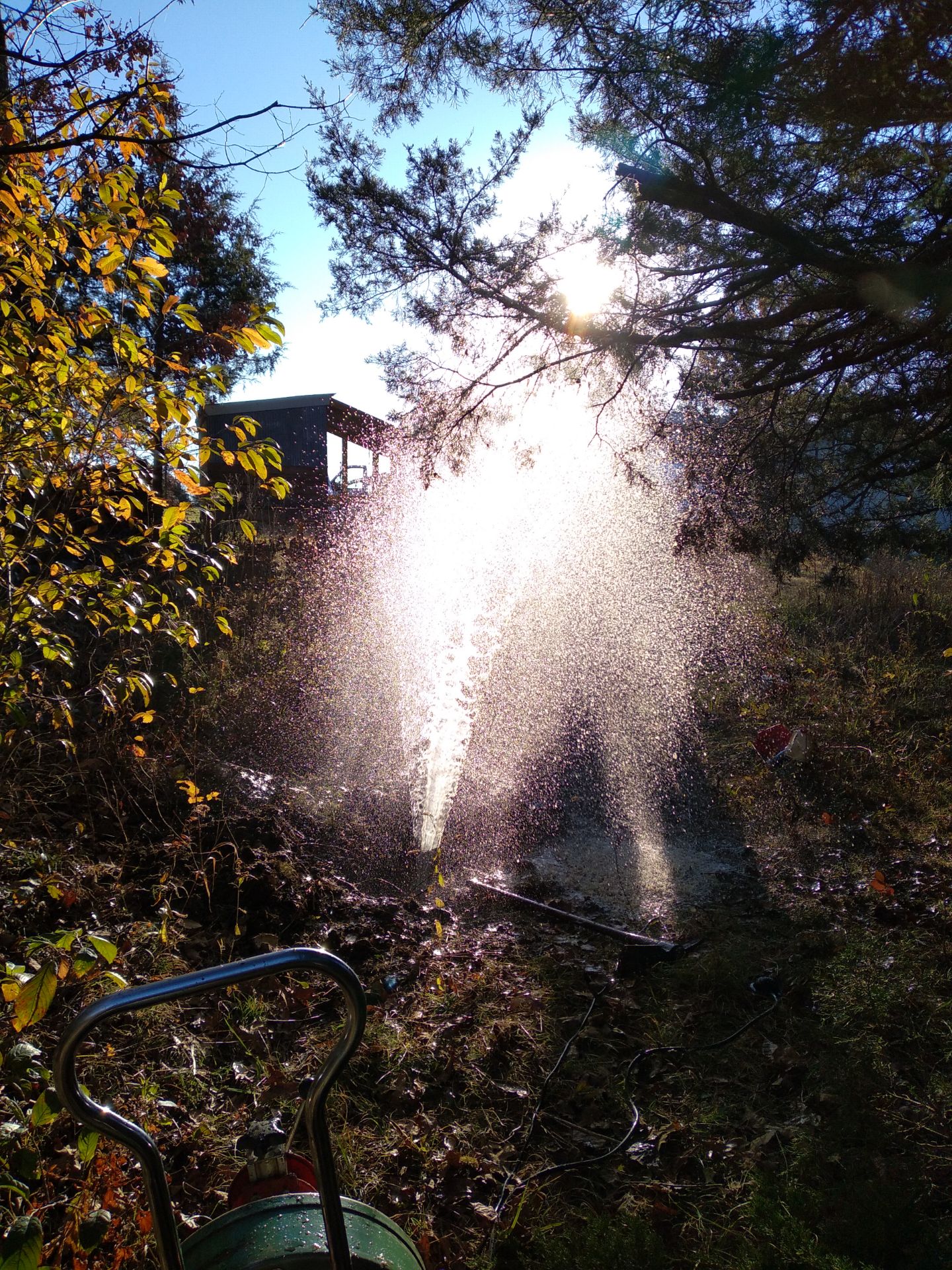 Installing a cleanout to reduce pressure of an underground clog. 