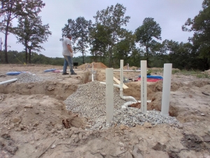 Laying pipe in the ground before a cement pad is poured for a new home. 