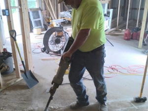 And the only way to get drain pipes under a pre-existing cement pad, Jack hammers!